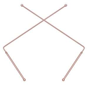 Two rose-gold metal knitting needles crossed on a white background