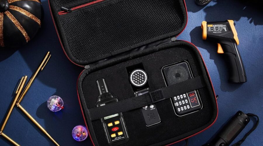 Portable ghost hunting kit in black case showing EMF meter, thermometer, UV flashlight, voice recorder, LED light-up balls.
