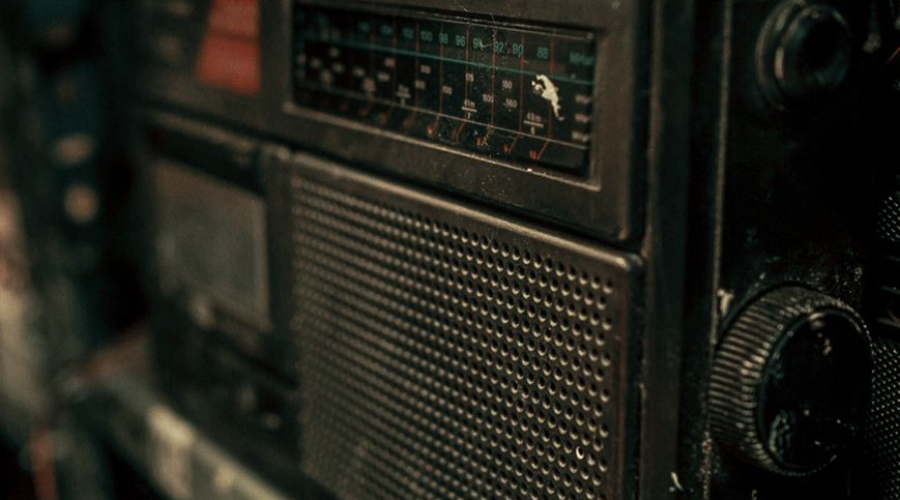 dirty retro radio standing on shelf