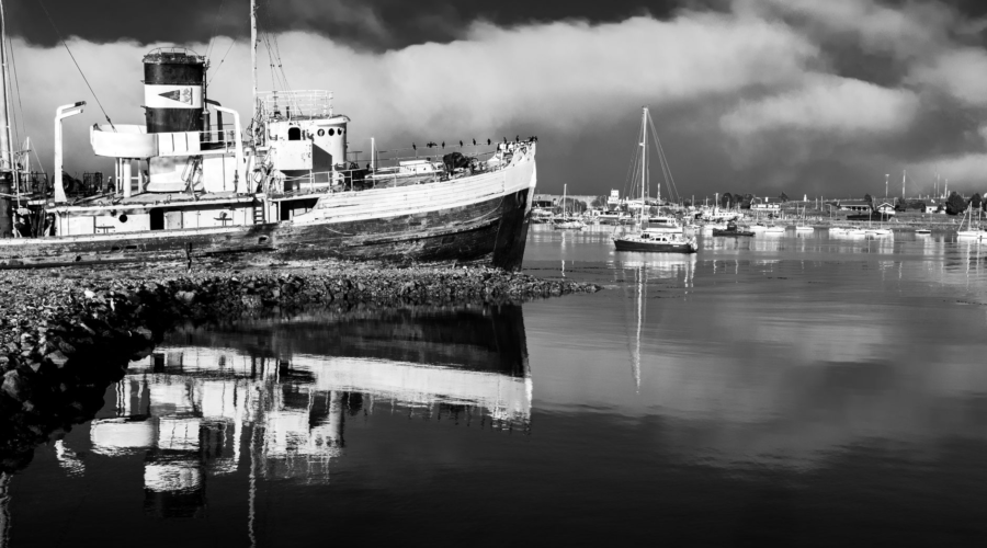 black and white scenic view of ushuaia harbor