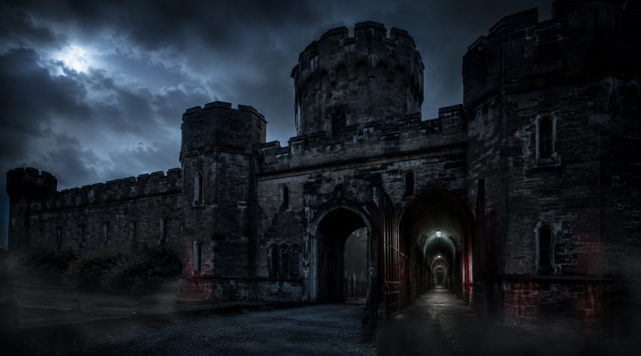 Dark medieval castle entrance under a stormy night sky, eerie and foreboding