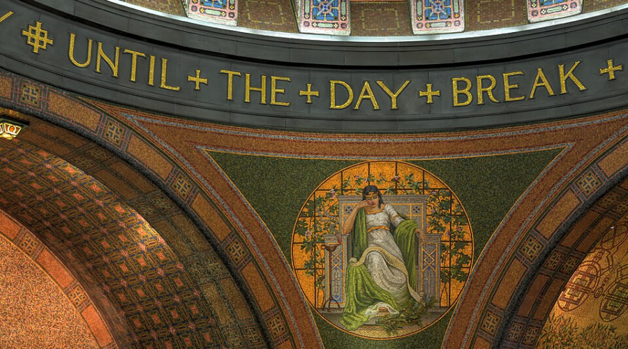 Byzantine-style chapel interior with golden arches, colorful mosaics, and “UNTIL THE DAY BREAK”