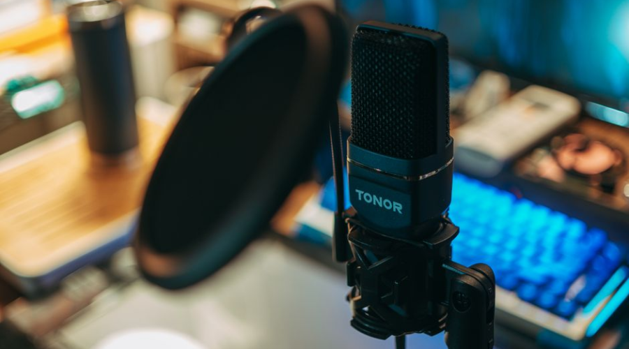 Tonor microphone with pop filter on desk for podcasting or streaming