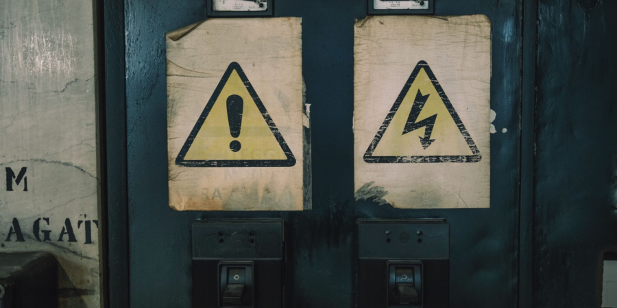 industrial warning signs on electrical panel