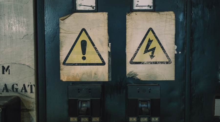 industrial warning signs on electrical panel