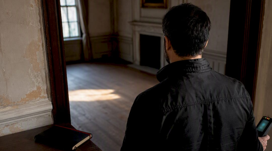 Investigator checking historic room conditions