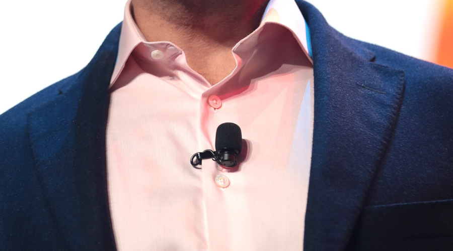 Close view of a lavalier microphone clipped to a shirt